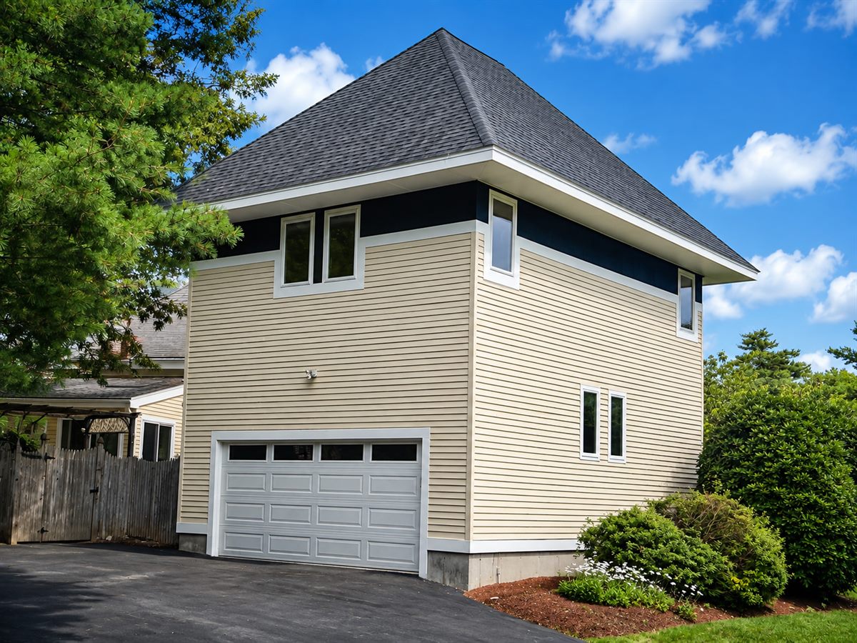 Garage converted into living space with a second story addition ADU above